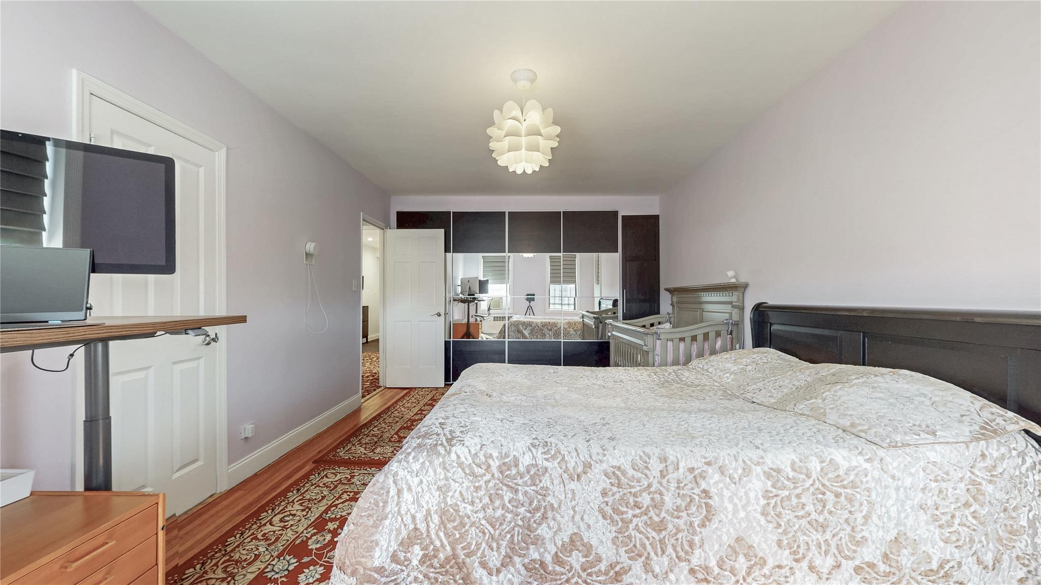 143-50 Hoover Avenue, Unit 507 Queens, NY 11435 - Photo 17 of 24 Bedroom featuring baseboards and wood finished floors