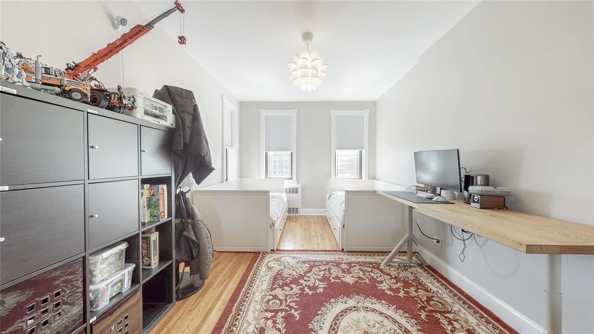 143-50 Hoover Avenue, Unit 507 Queens, NY 11435 - Photo 23 of 24 Office space featuring radiator, light wood-type flooring, and baseboards