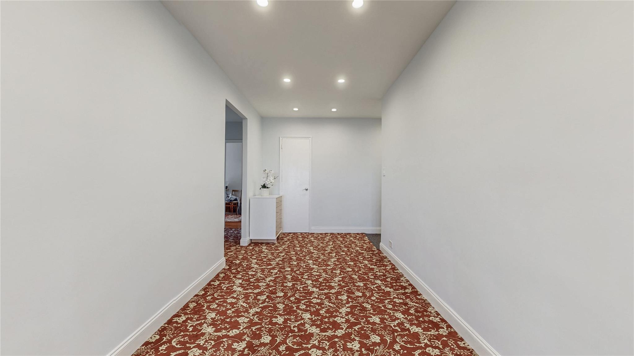 143-50 Hoover Avenue, Unit 507 Queens, NY 11435 - Photo 4 of 24 Hallway featuring baseboards, carpet floors, and recessed lighting