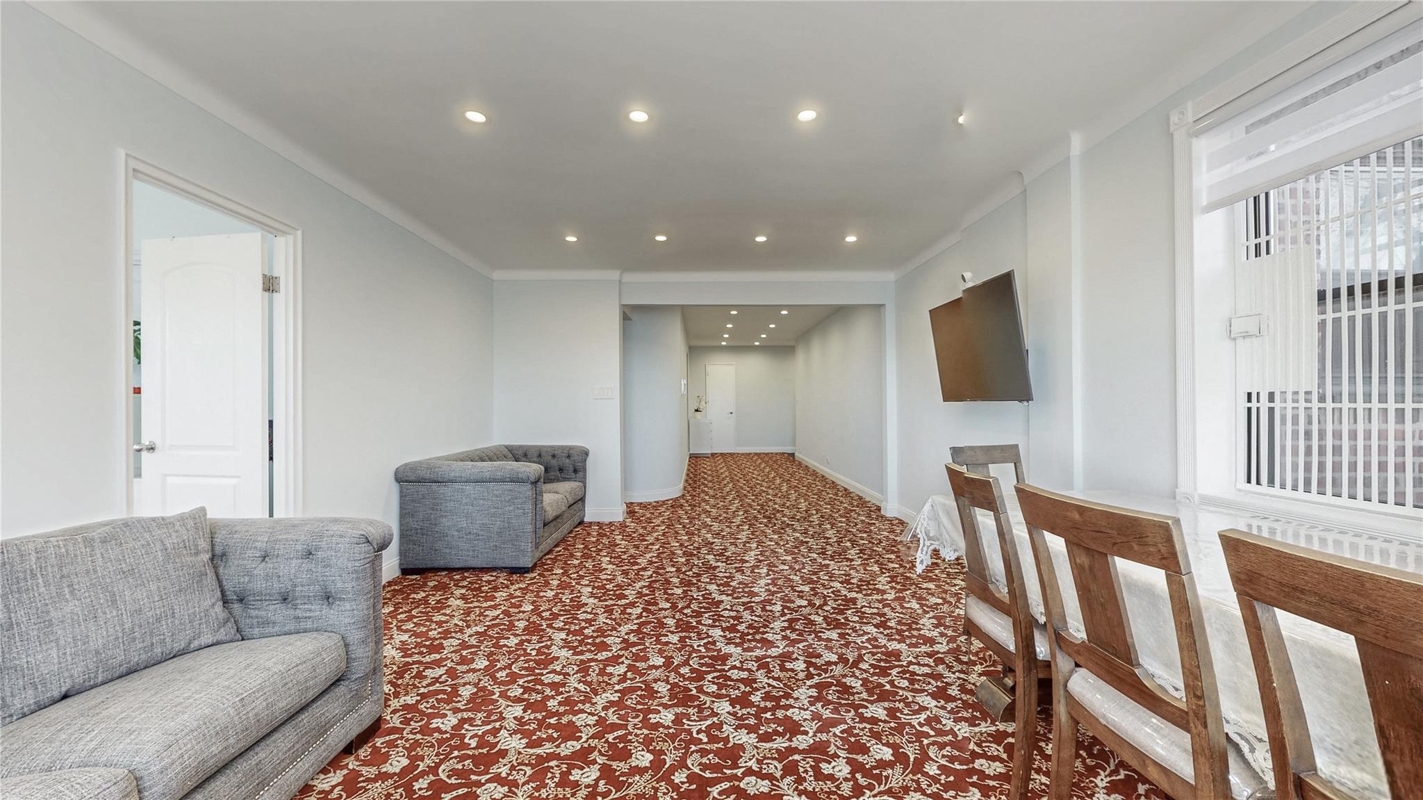 143-50 Hoover Avenue, Unit 507 Queens, NY 11435 - Photo 6 of 24 Corridor featuring baseboards, carpet, crown molding, and recessed lighting