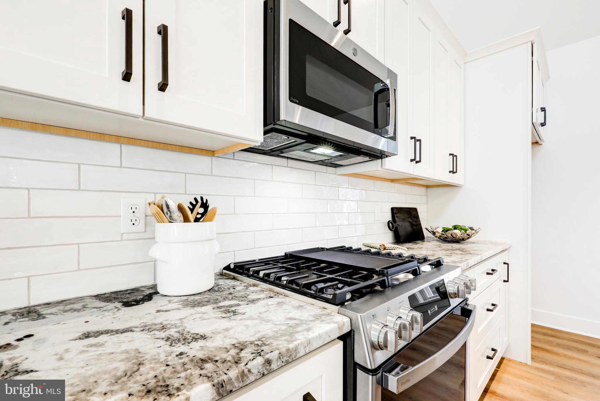 220 Parkside Place Lancaster, PA 17602 - Photo 13 of 49 a kitchen with a stove and a microwave