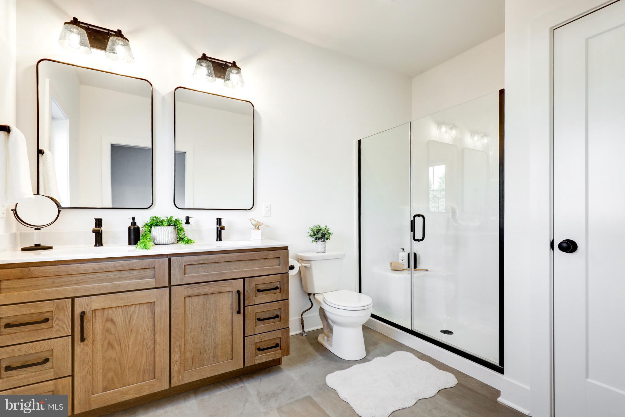 220 Parkside Place Lancaster, PA 17602 - Photo 25 of 49 a spacious bathroom with a double vanity sink toilet and shower
