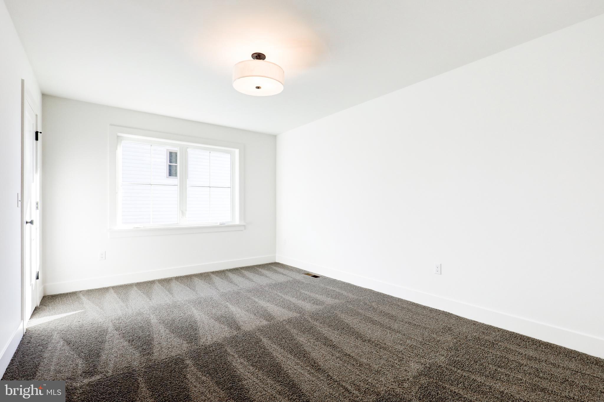 220 Parkside Place Lancaster, PA 17602 - Photo 32 of 49 an empty room with wooden floor and windows