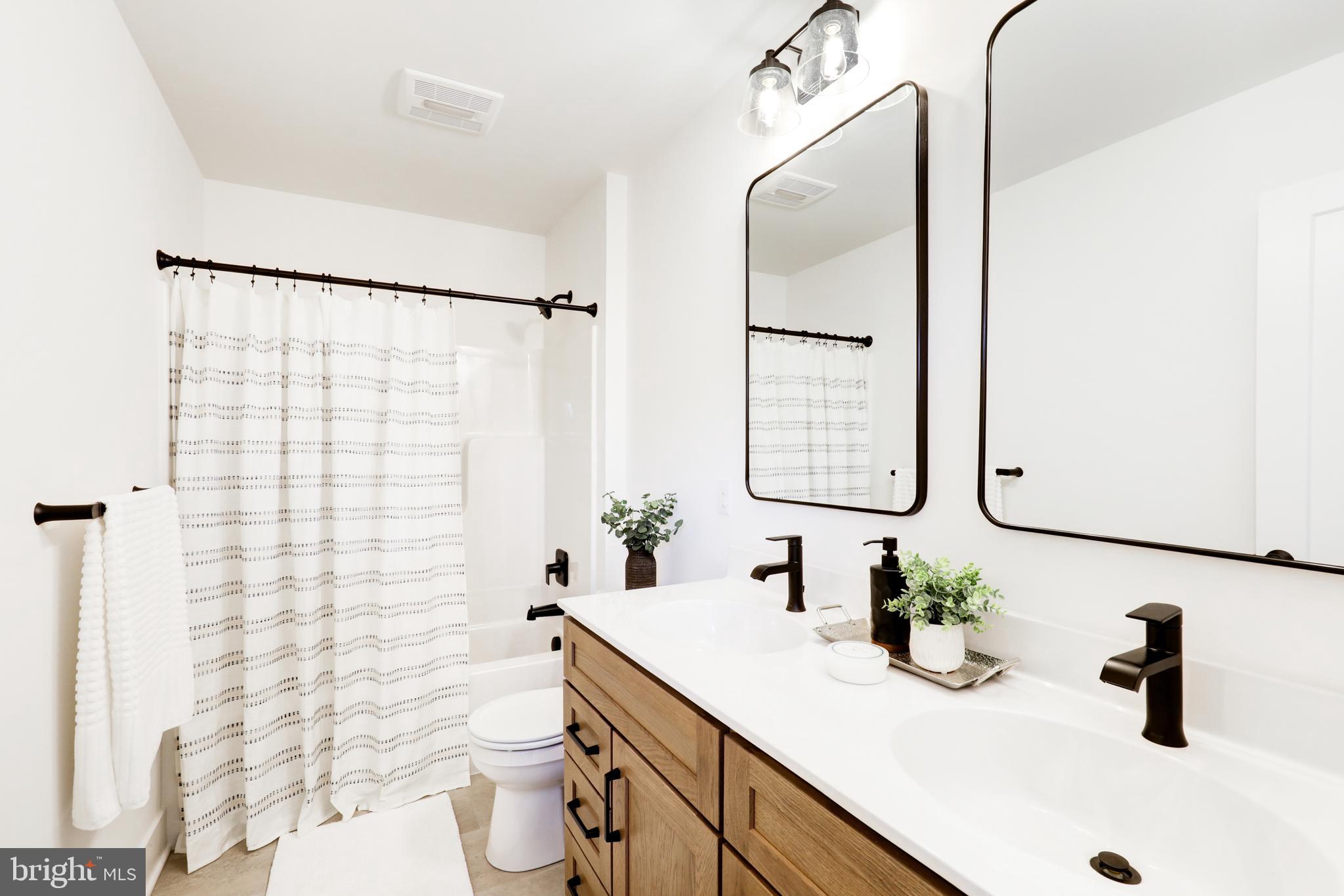 220 Parkside Place Lancaster, PA 17602 - Photo 34 of 49 a bathroom with a sink vanity mirror and toilet