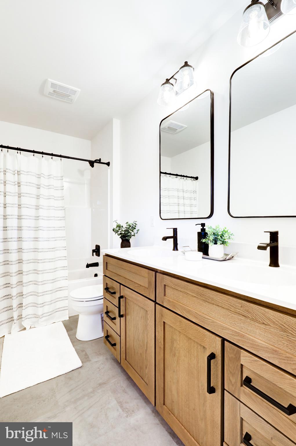 220 Parkside Place Lancaster, PA 17602 - Photo 35 of 49 a bath room with a sink and a mirror