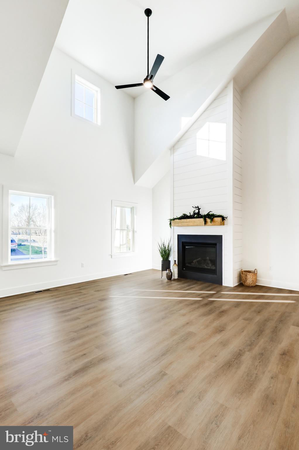 220 Parkside Place Lancaster, PA 17602 - Photo 5 of 49 a view of empty room with fireplace and wooden floor