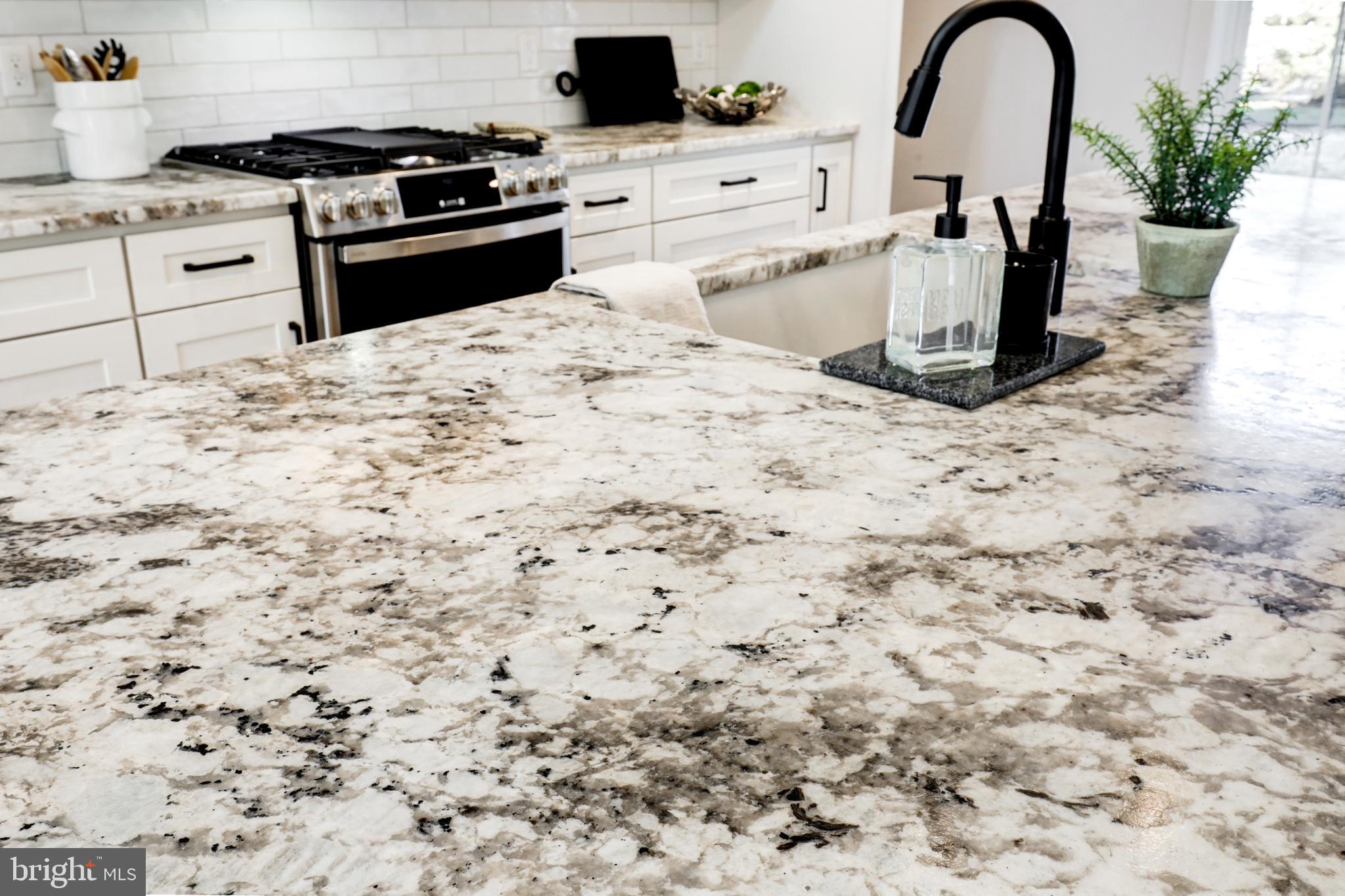 220 Parkside Place Lancaster, PA 17602 - Photo 9 of 49 a kitchen with a stove a refrigerator and a stove top oven