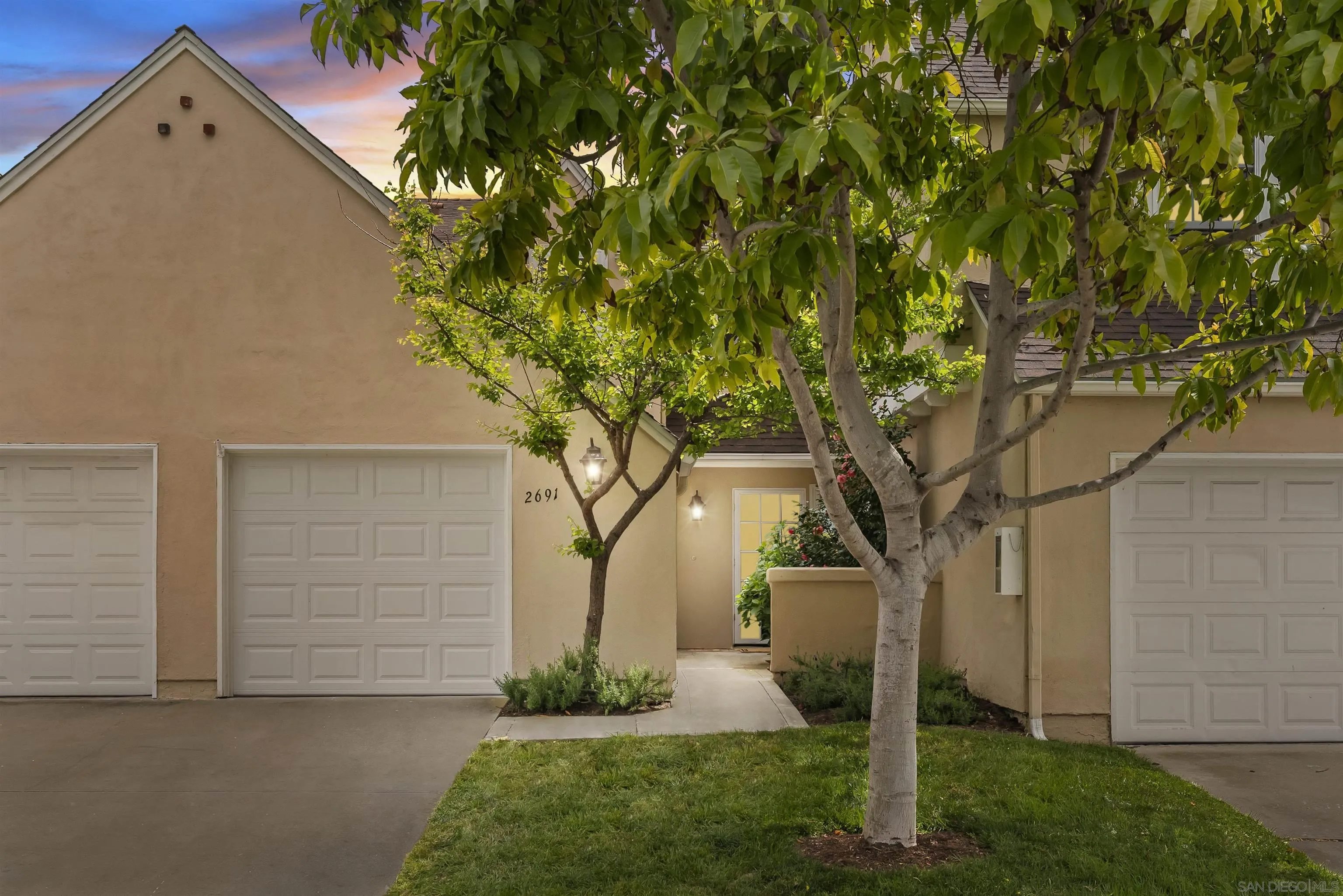 2691 Coventry Road Carlsbad, CA 92010 - Photo 12 of 19 front view of a house with a yard and an trees