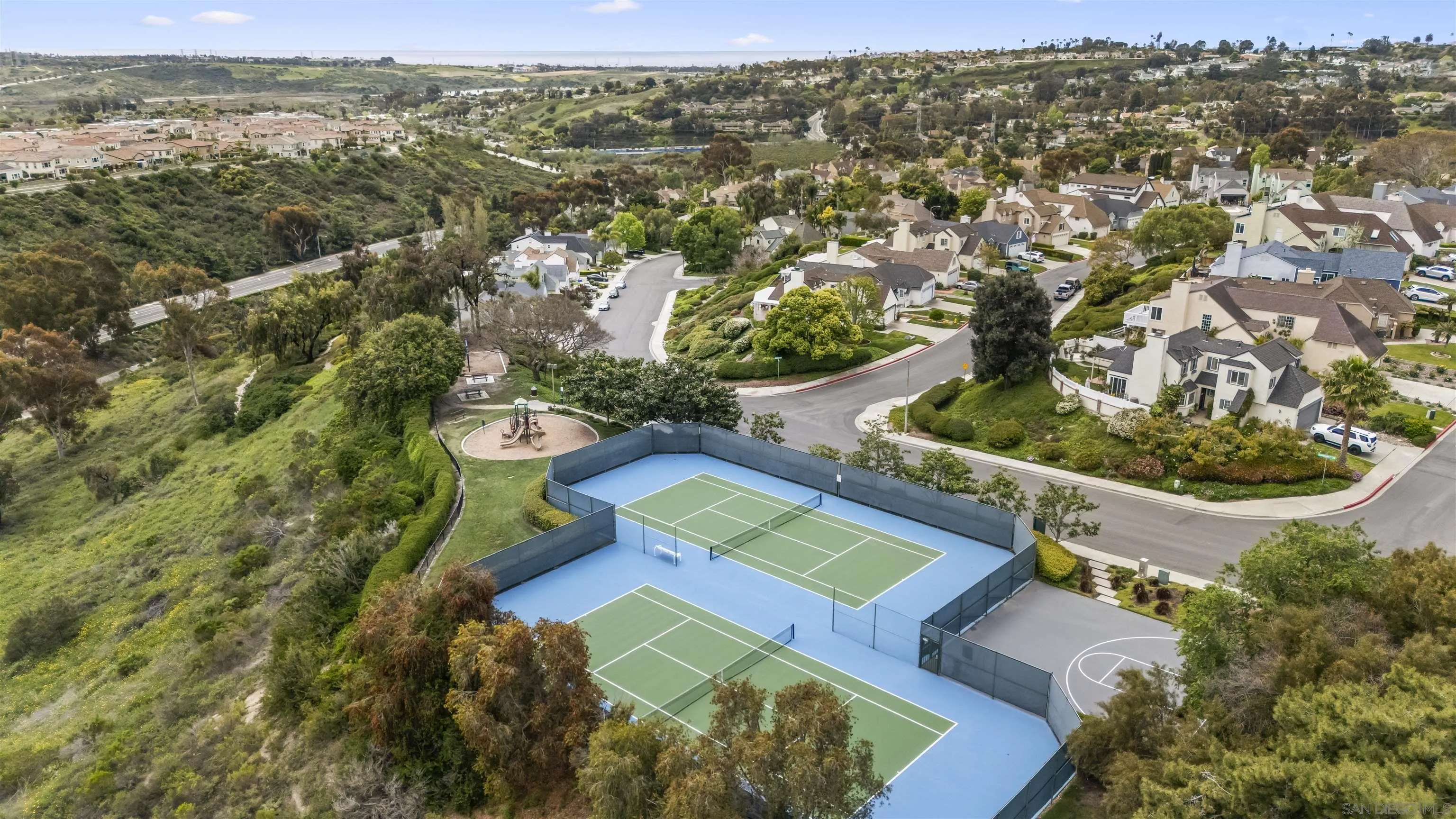 2691 Coventry Road Carlsbad, CA 92010 - Photo 14 of 19 an aerial view of residential houses with outdoor space and trees