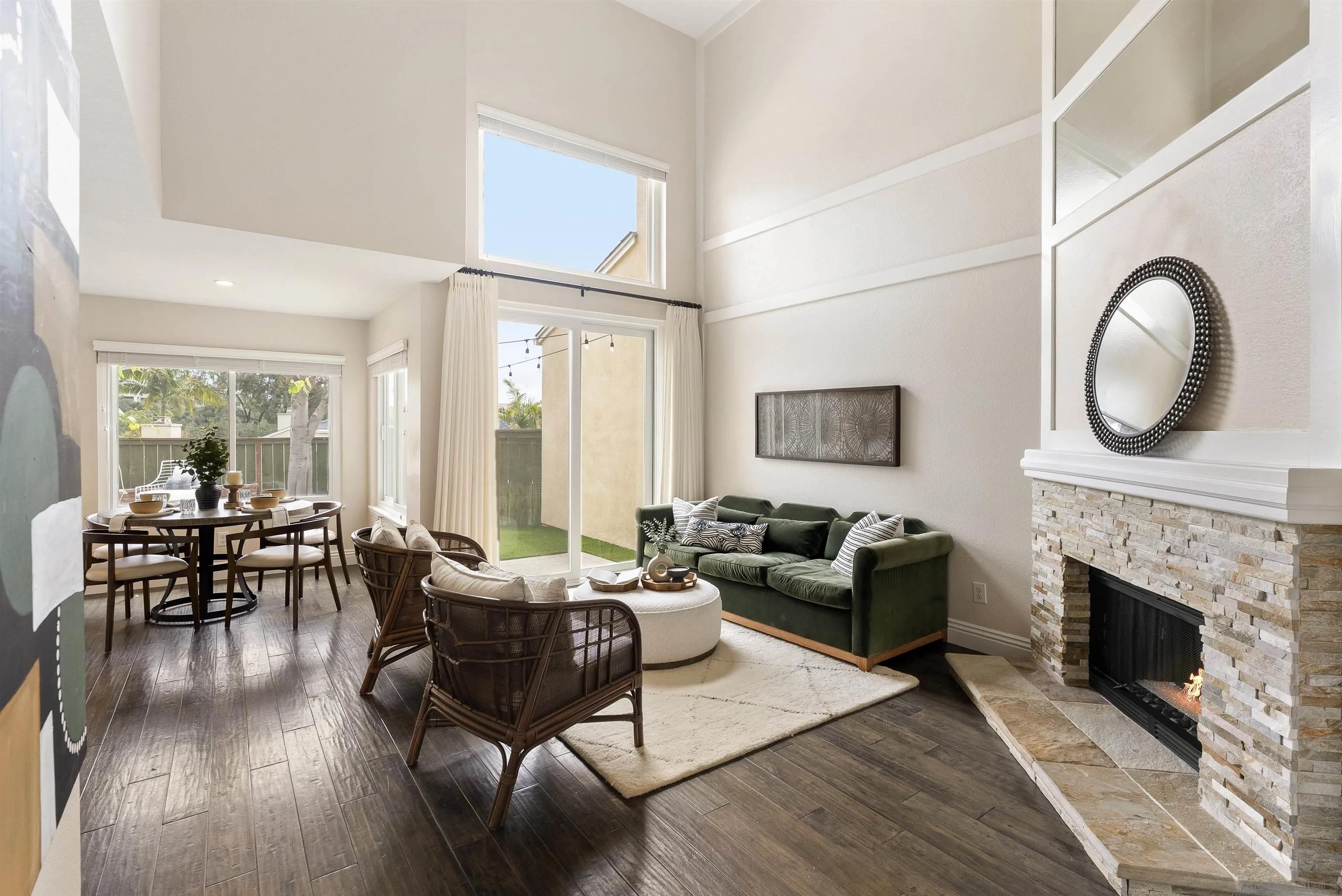 2691 Coventry Road Carlsbad, CA 92010 - Photo 2 of 19 a living room with furniture a fireplace a rug and wooden floor
