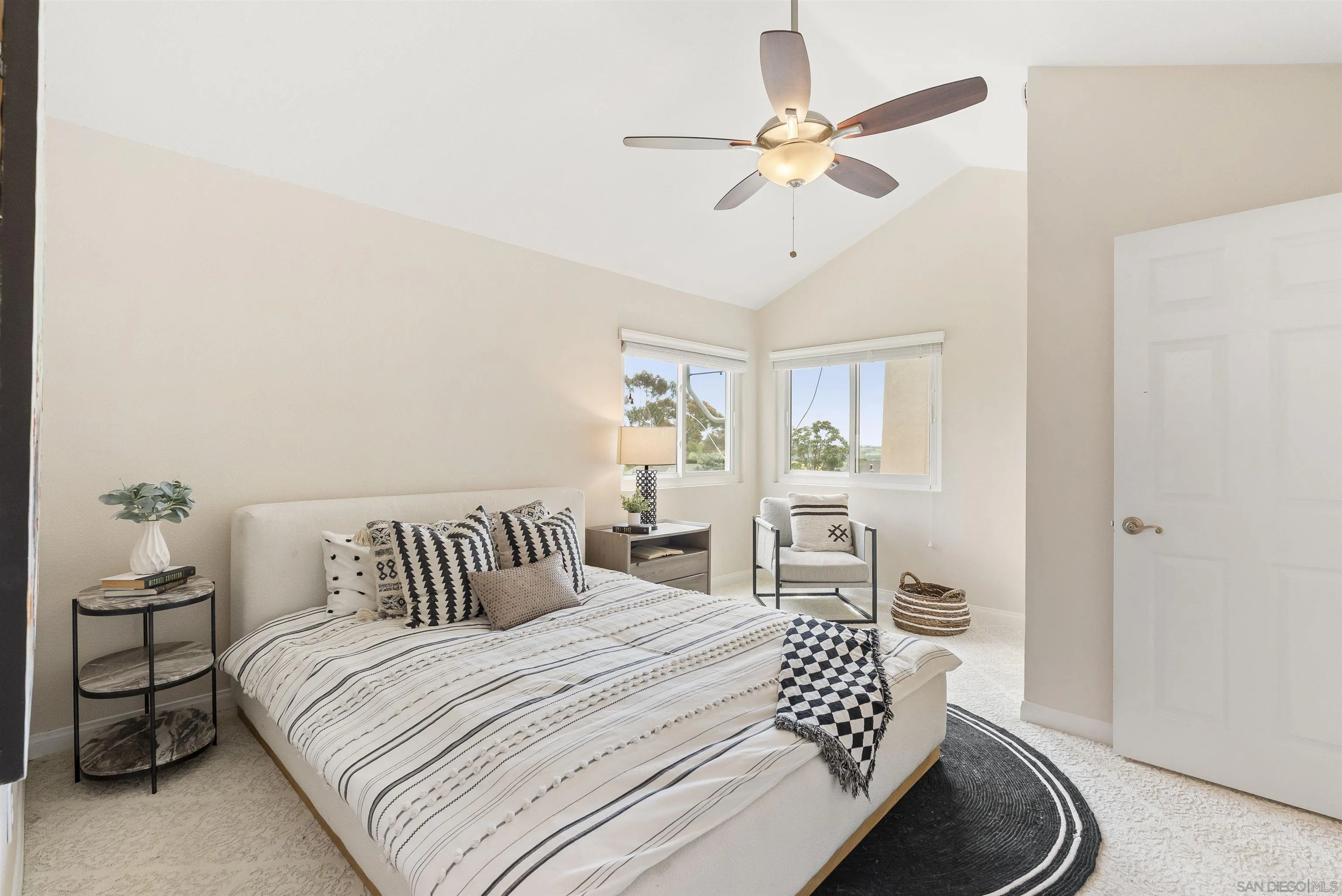 2691 Coventry Road Carlsbad, CA 92010 - Photo 8 of 19 a bedroom with a large bed and a chandelier