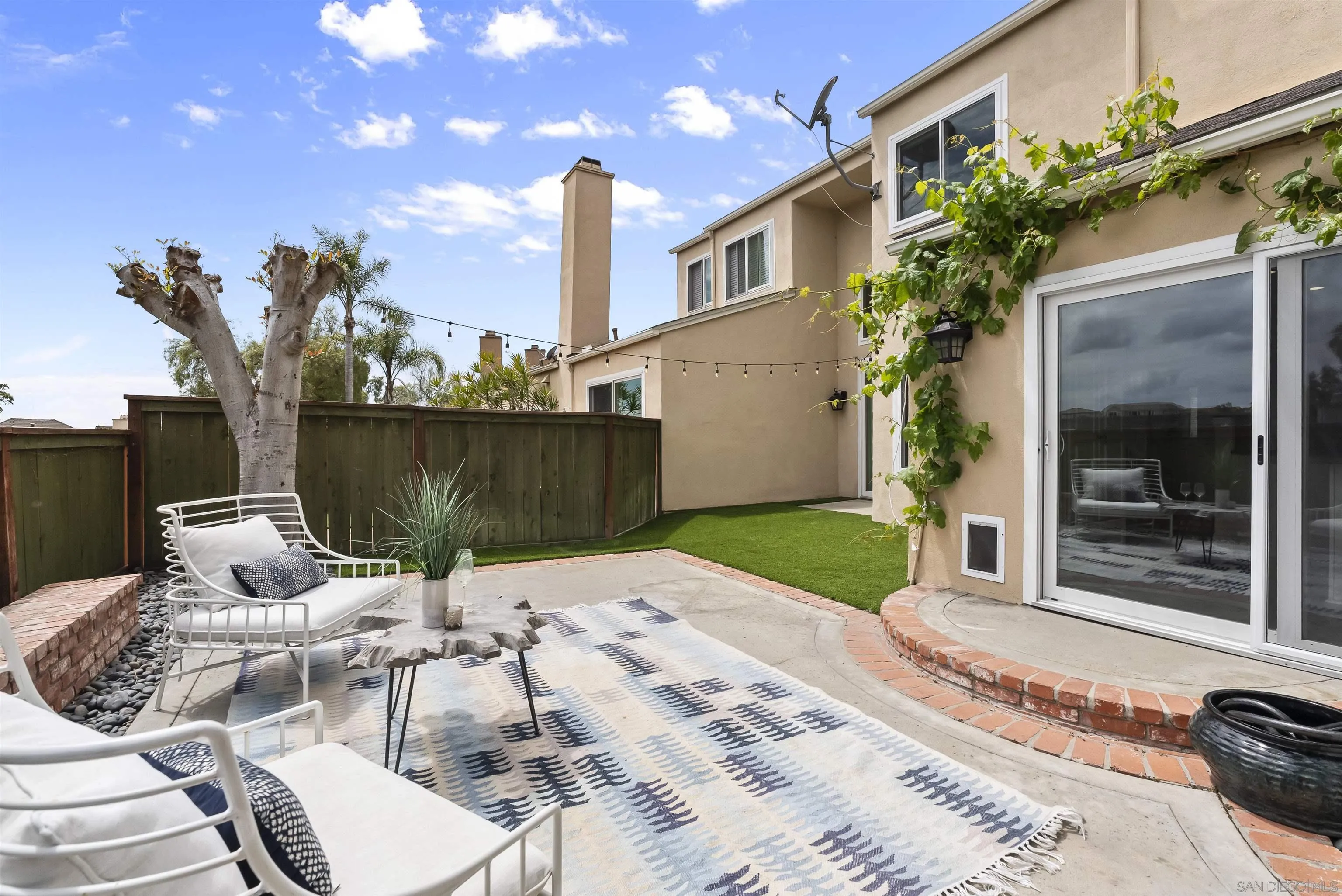 2691 Coventry Road Carlsbad, CA 92010 - Photo 10 of 19 a view of a patio with table and chairs and potted plants