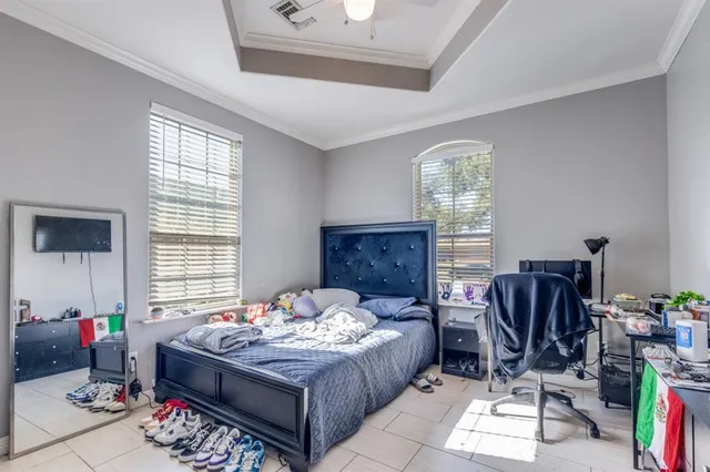 a bedroom with bed and a window