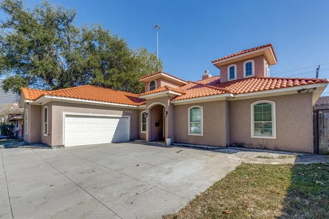 a front view of a house with a garage