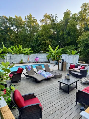 a view of yard from deck having patio