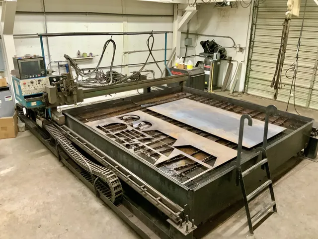 a bed sitting in a room next to a window