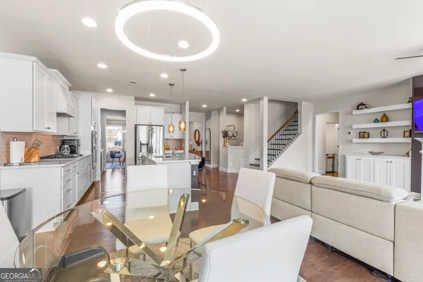 a view of entryway with furniture and wooden floor