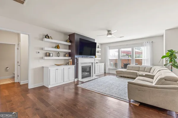 a en suite bathroom with a toilet sink and a mirror