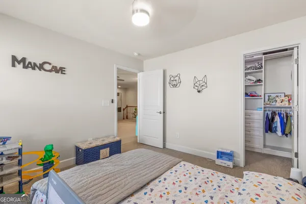 a bedroom with a bed and window