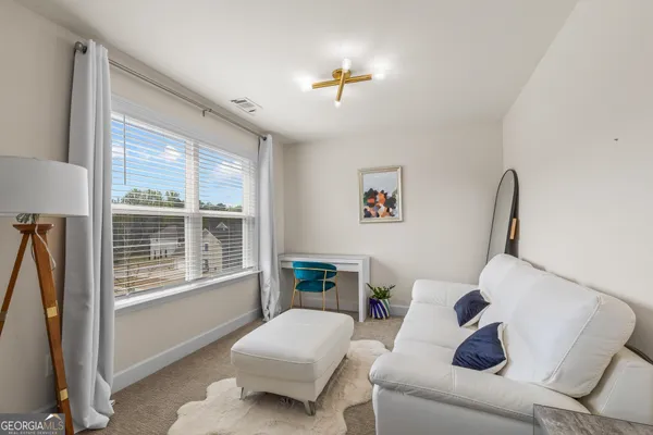 a view of an outdoor space with swimming pool and furniture