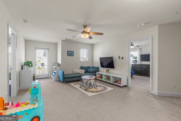 a view of a swimming pool with sitting area