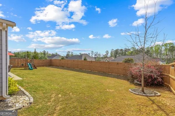 a view of a swimming pool with lounge chair