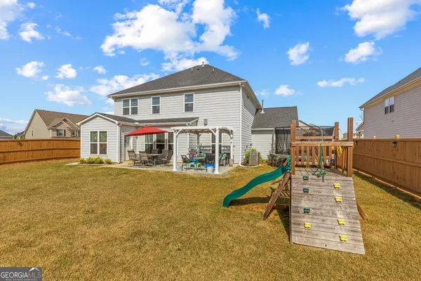 a view of a building with a big yard