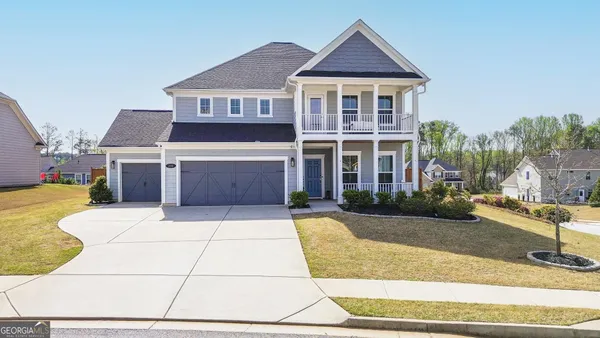 a view of a chairs and table in backyard