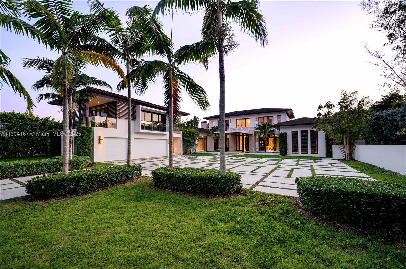 9000 Southwest 63rd Court Pinecrest, FL 33156 - Photo 12 of 36 a view of a house with a yard and palm trees