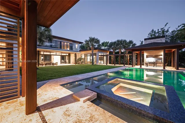 a view of swimming pool with a patio