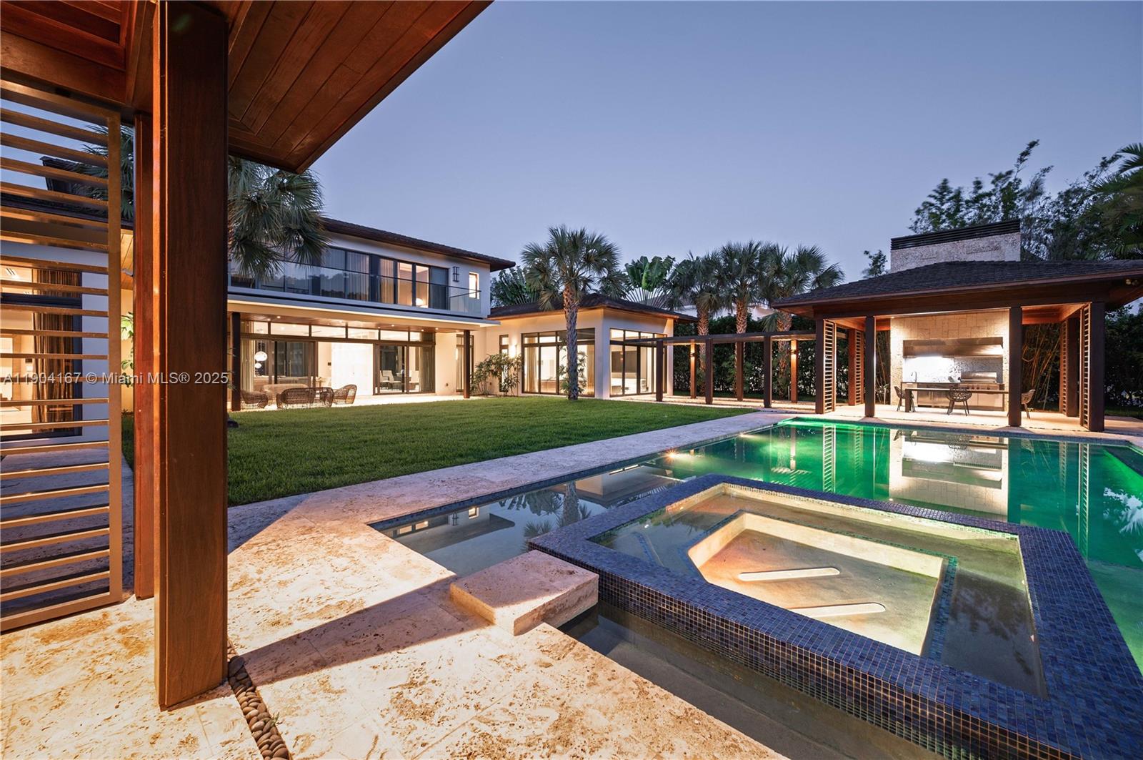 9000 Southwest 63rd Court Pinecrest, FL 33156 - Photo 16 of 36 a view of swimming pool with a patio