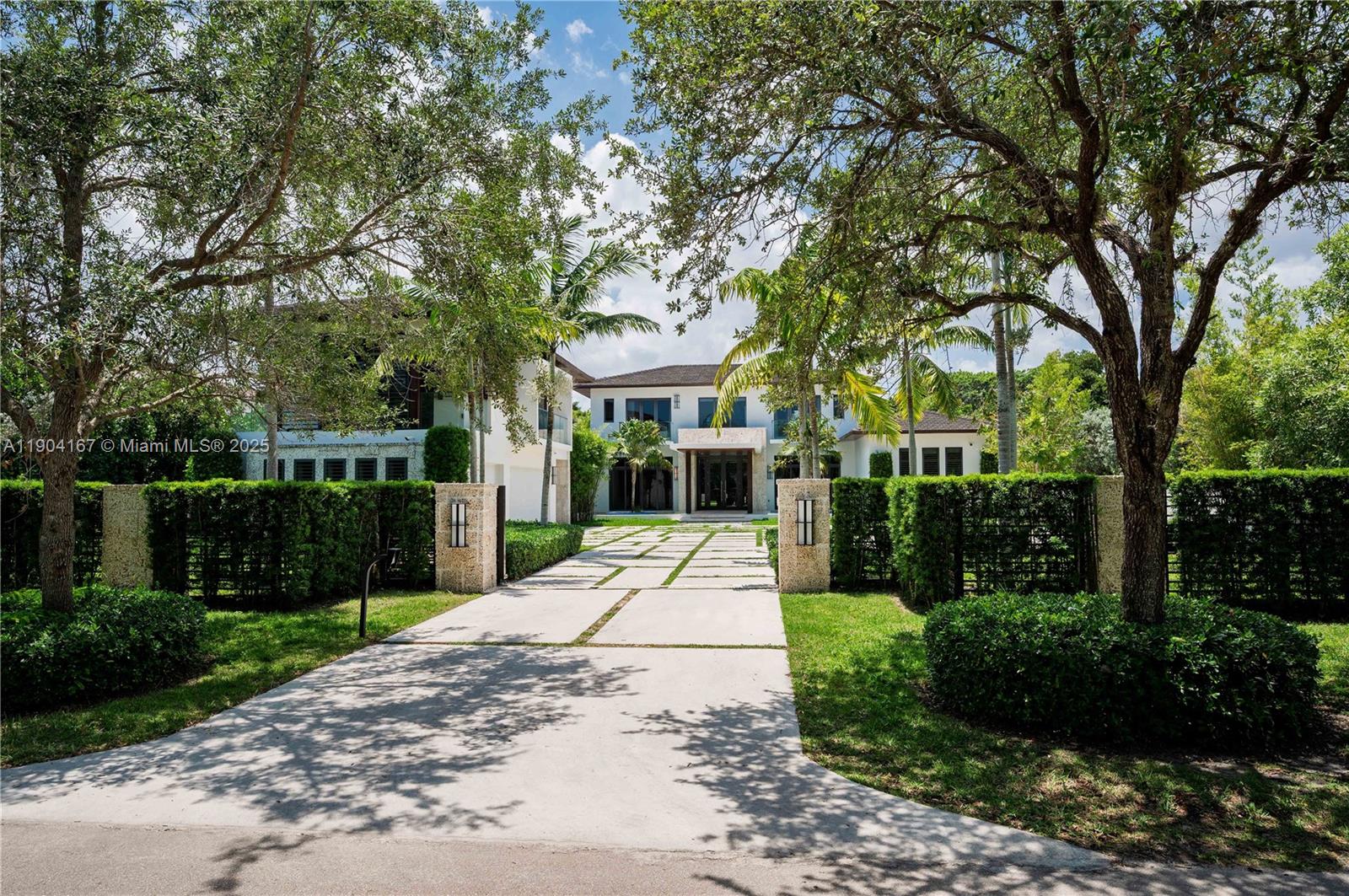 9000 Southwest 63rd Court Pinecrest, FL 33156 - Photo 2 of 36 a view of a park with plants and large trees