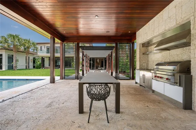 a view of a chairs and table in the patio