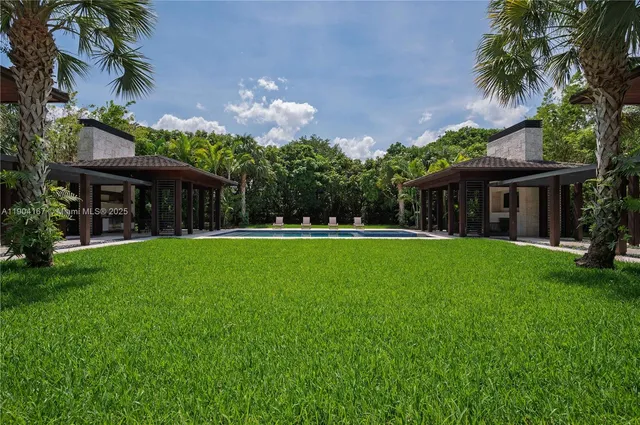 a view of house with a yard