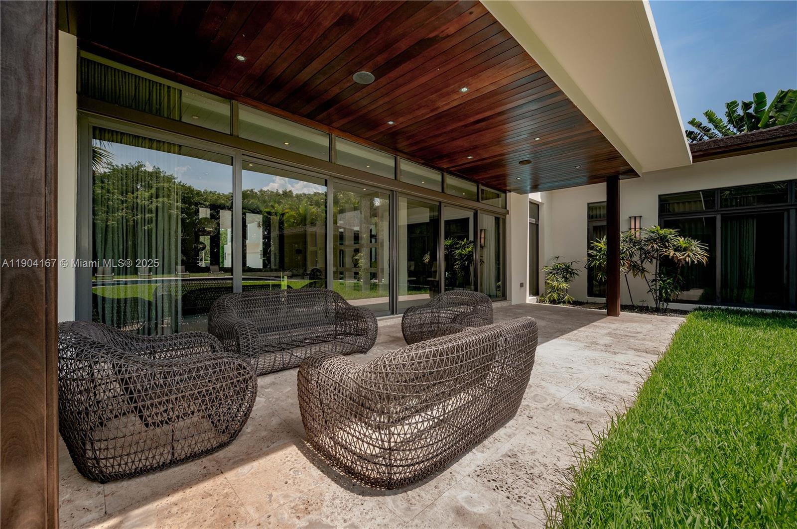 9000 Southwest 63rd Court Pinecrest, FL 33156 - Photo 31 of 36 a view of a porch with furniture and garden