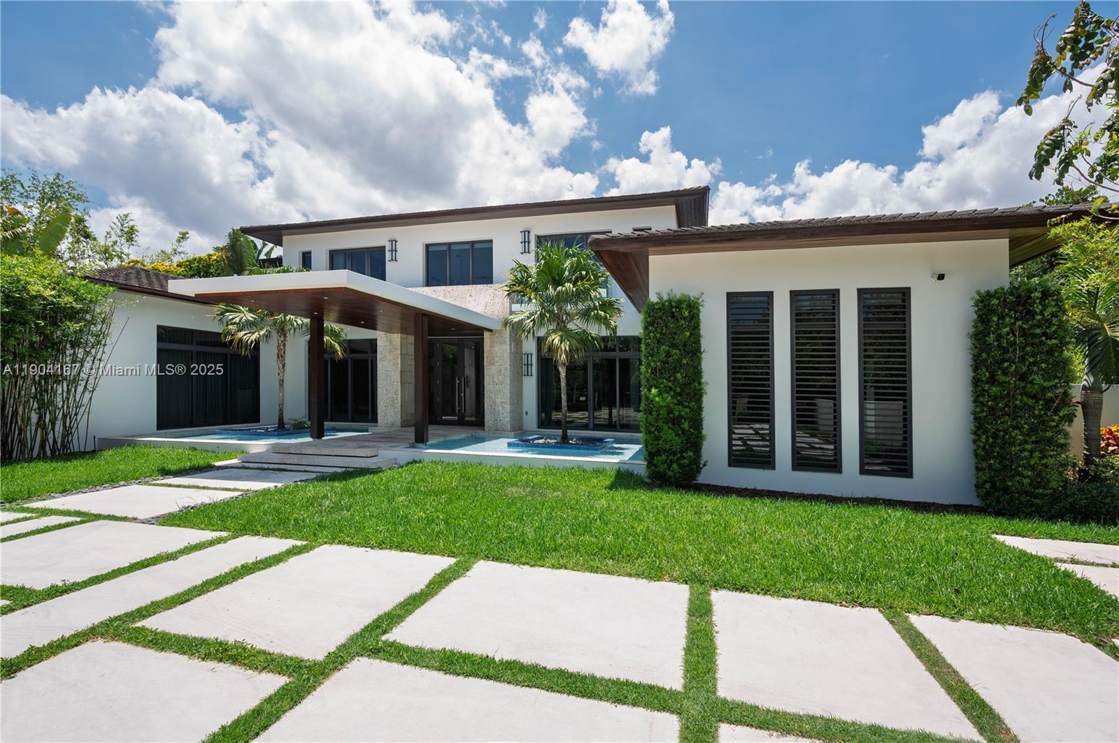 9000 Southwest 63rd Court Pinecrest, FL 33156 - Photo 5 of 36 a view of a yard in front of house