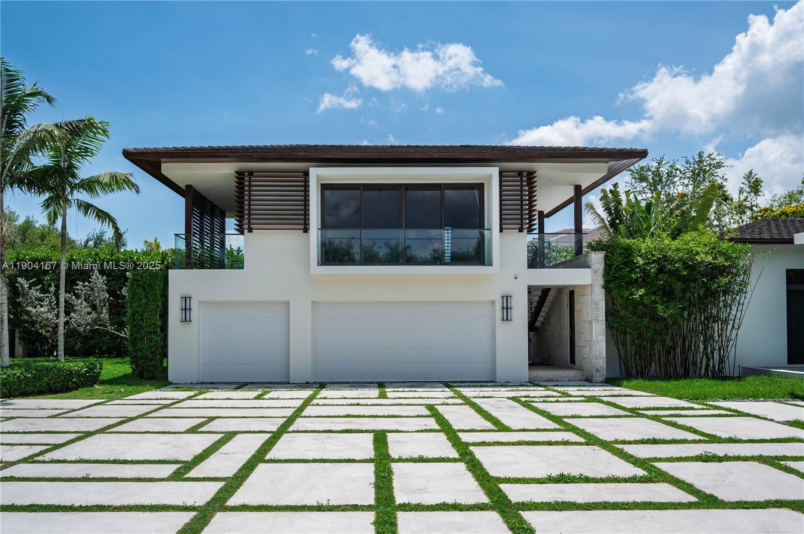 9000 Southwest 63rd Court Pinecrest, FL 33156 - Photo 7 of 36 a view of a house with a patio