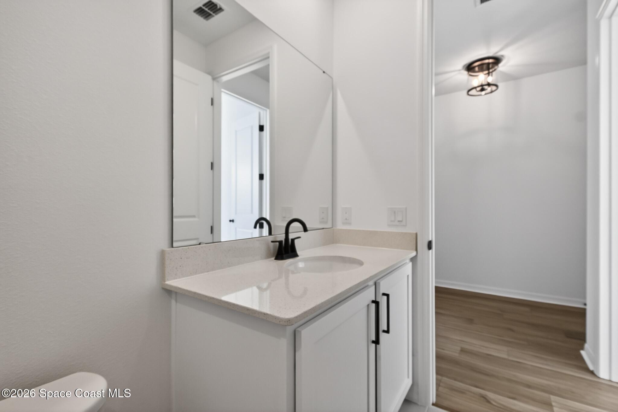 4372 Dockyard Drive Rockledge, FL 32955 - Photo 14 of 24 a bathroom with a sink and a mirror