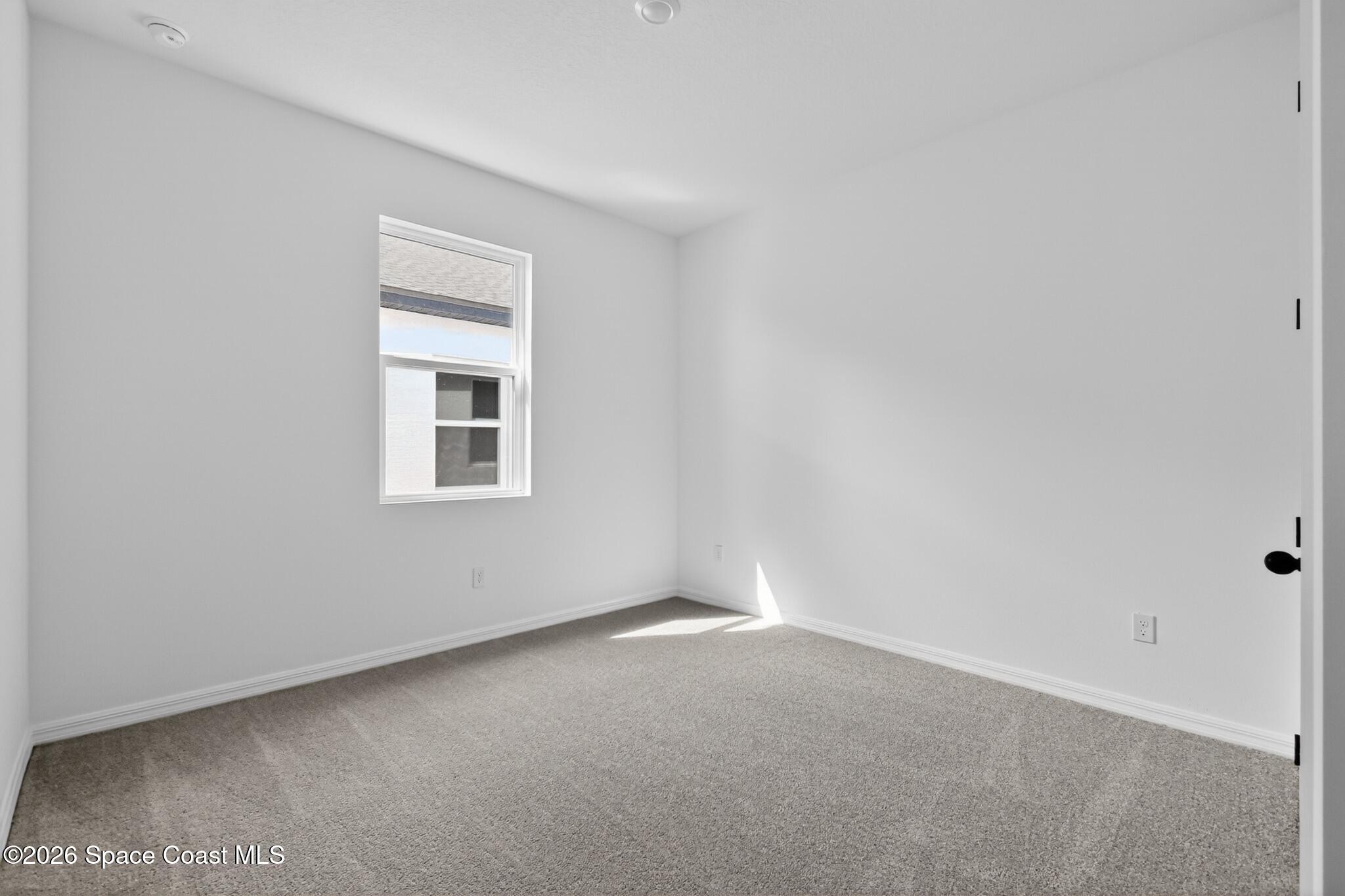 4372 Dockyard Drive Rockledge, FL 32955 - Photo 15 of 24 a view of an empty room with a window