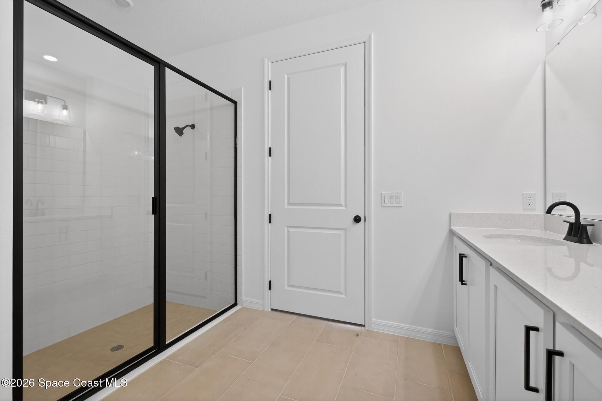 4372 Dockyard Drive Rockledge, FL 32955 - Photo 18 of 24 a bathroom with a sink and shower