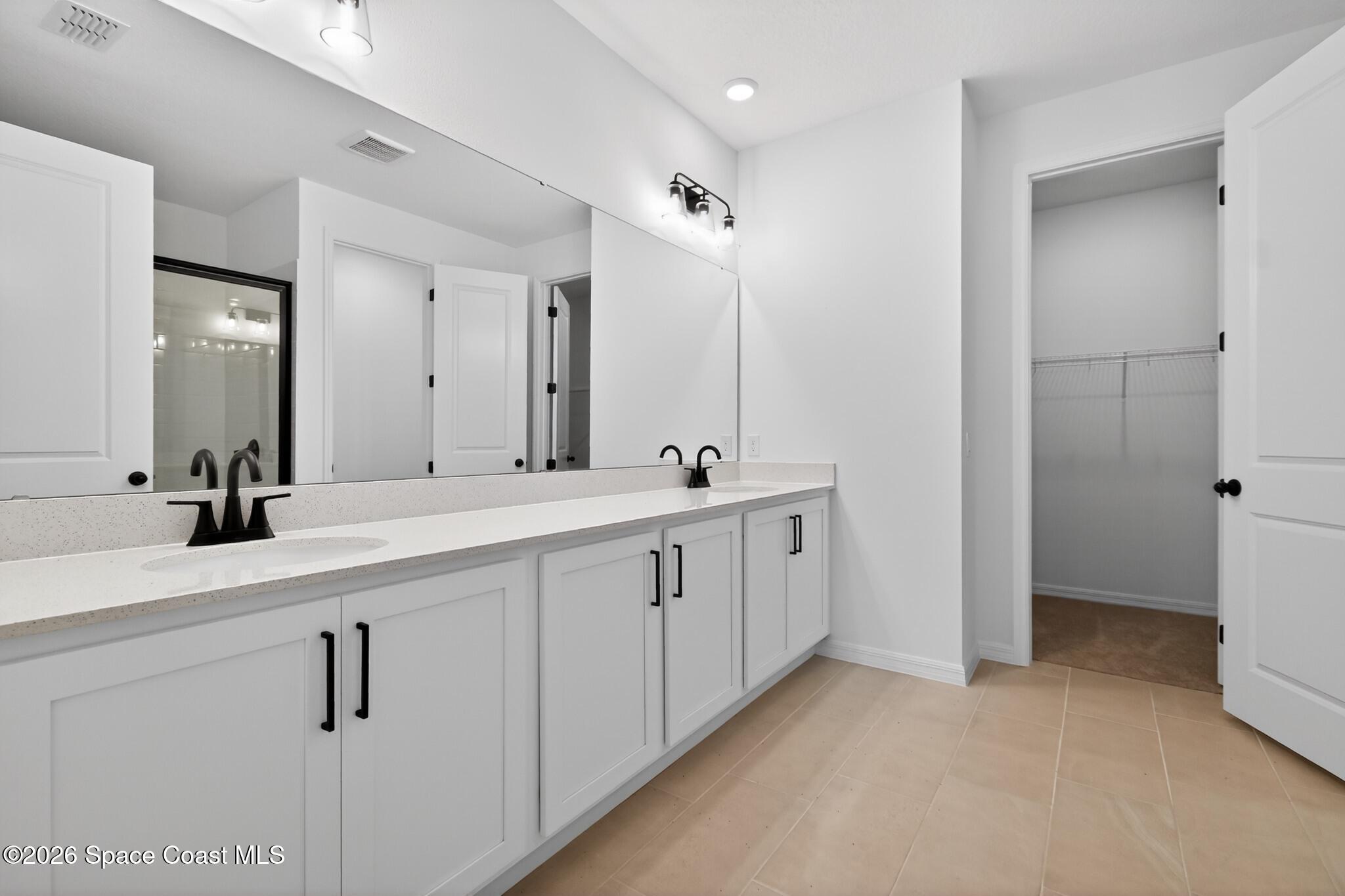4372 Dockyard Drive Rockledge, FL 32955 - Photo 19 of 24 a bathroom with double sink and a mirror