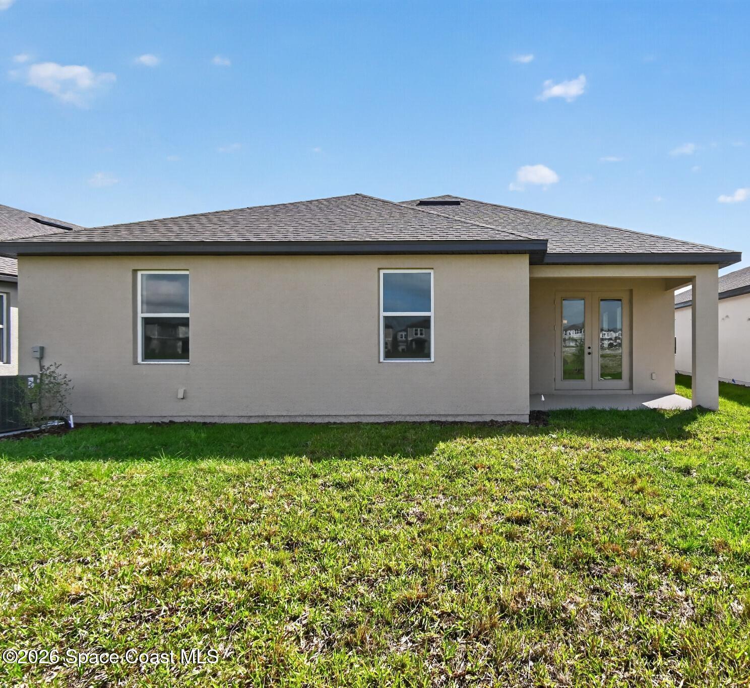 4372 Dockyard Drive Rockledge, FL 32955 - Photo 22 of 24 a backyard of a house with lots of green space