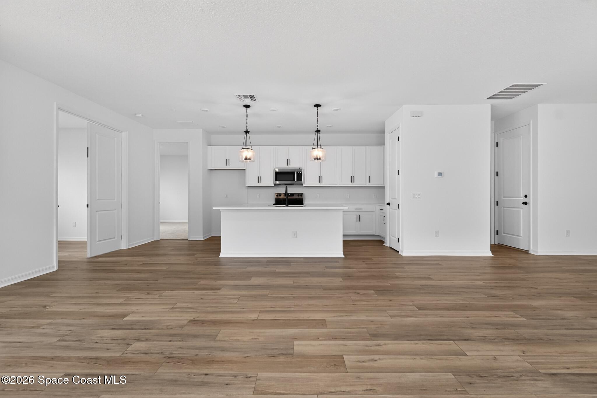 4372 Dockyard Drive Rockledge, FL 32955 - Photo 6 of 24 a view of a kitchen with wooden floor