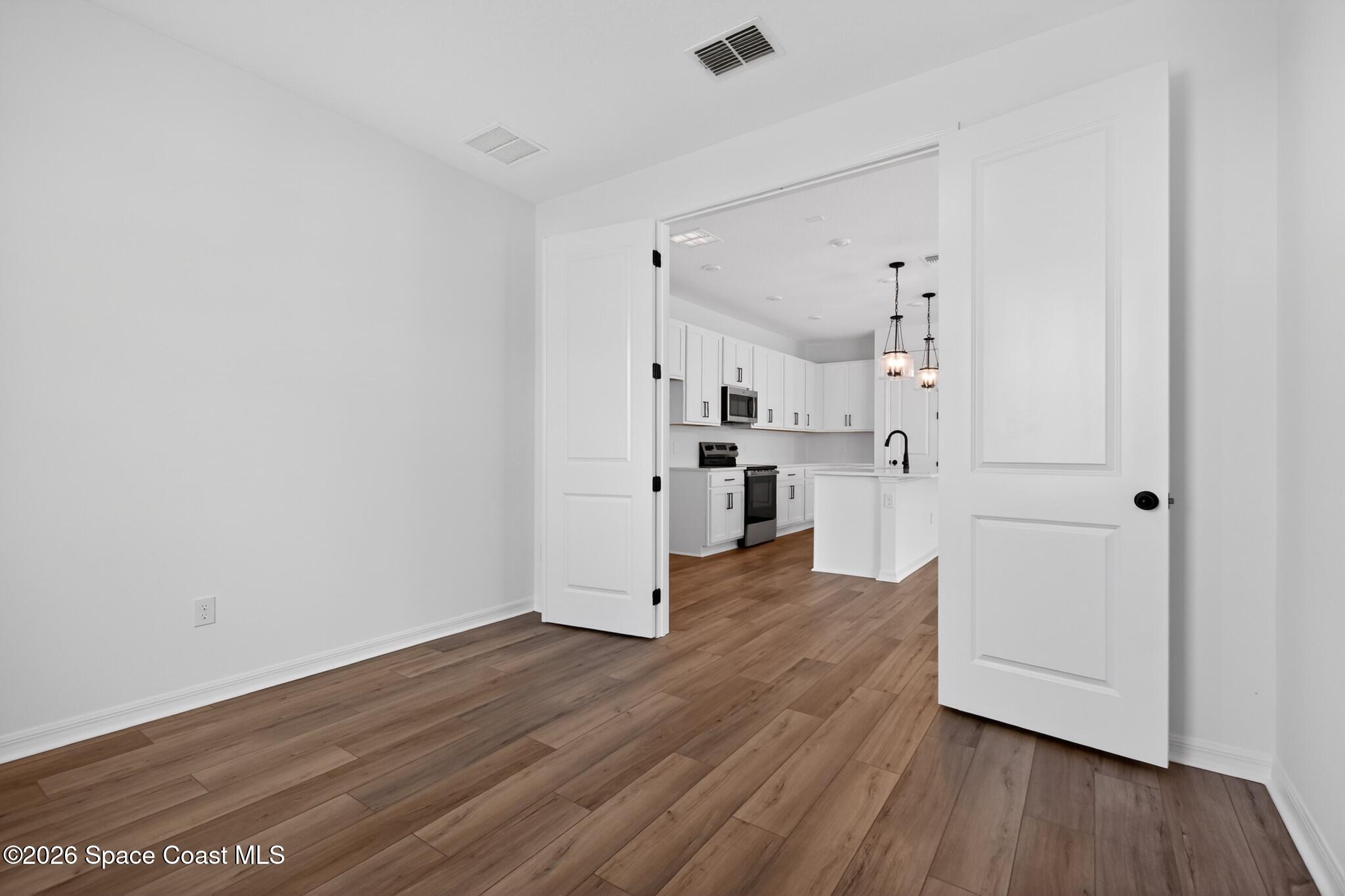 4372 Dockyard Drive Rockledge, FL 32955 - Photo 10 of 24 a view of a kitchen with wooden floor