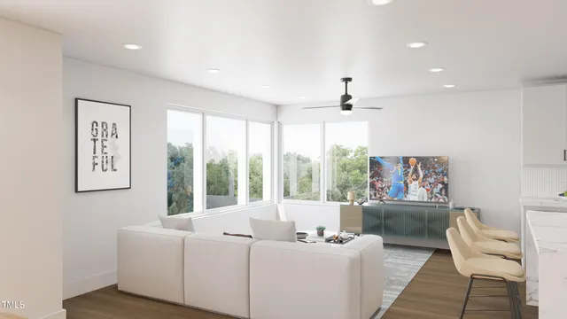 a living room with furniture and a large window