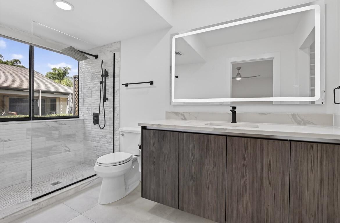 373 Northwest 94th Terrace Plantation, FL 33324 - Photo 5 of 10 a bathroom with a sink toilet and shower
