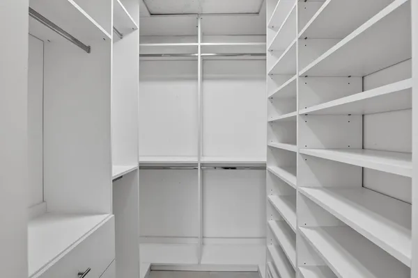 a view of an empty walk in closet