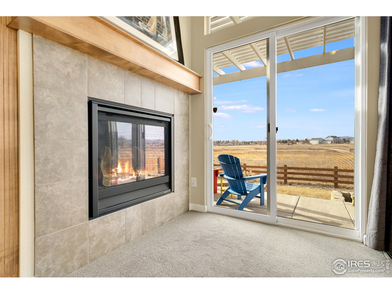 709 Snowy Plain Road Fort Collins, CO 80525 - Photo 13 of 40 Tiled fireplace in the great room