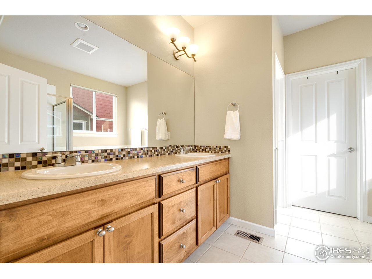 709 Snowy Plain Road Fort Collins, CO 80525 - Photo 18 of 40 Double sinks and a large vanity