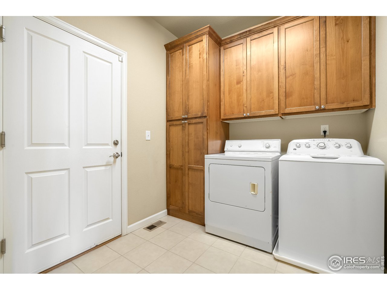 709 Snowy Plain Road Fort Collins, CO 80525 - Photo 35 of 40 Laundry room with storage cabinets